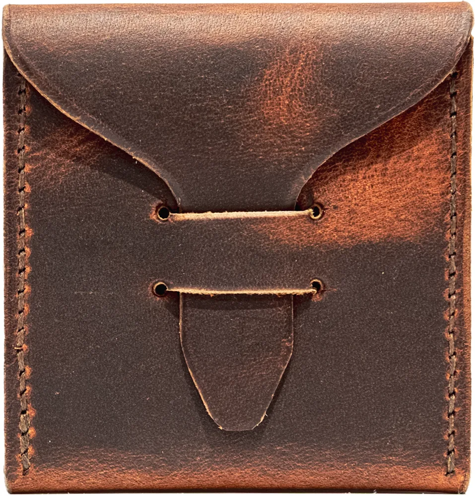 Copperhead Brown pick case, closed. Waxy, mottled brown leather, hand-stitched down each side.