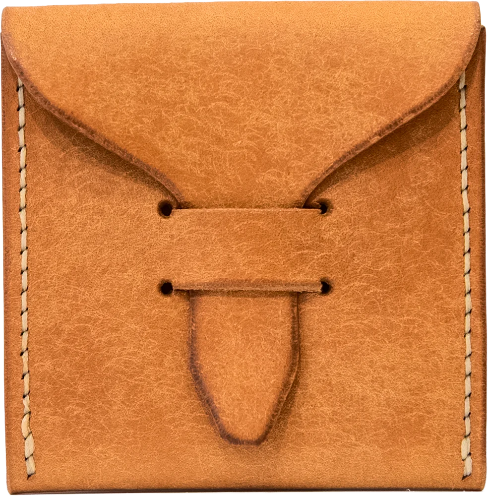Pueblo Olmo pick case, closed. Light caramel leather with a dry, cracked texture, stitched in cream thread down each side.